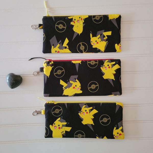 Pokémon Pikachu on black, pencil case, fabric zip bag, handmade with small clip on swivel hook, 4.5 inches tall x 9.5 inches wide