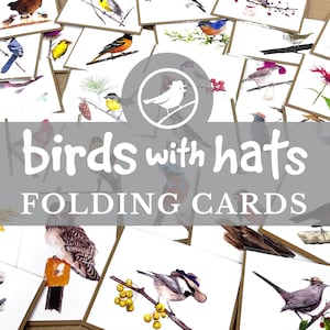 May include: A collection of "Birds with Hats" folding cards. Each card features a watercolor illustration of a bird wearing a hat, set against a white background. The cards are arranged on a surface, with the title text overlayed on the image.