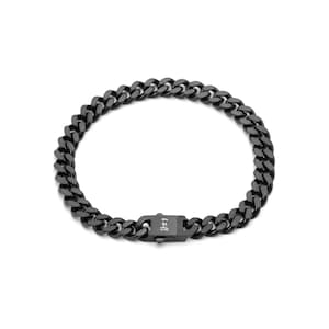 May include: A black curb chain bracelet. The bracelet features a series of interlocking, rounded links. The clasp is a matching black color and has a small, rectangular design. The bracelet is displayed on a white background.