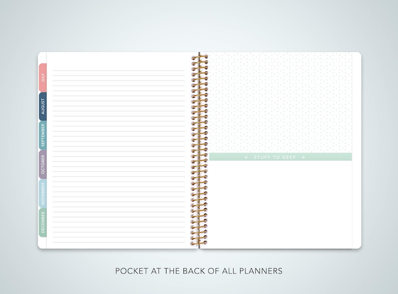 May include: An open spiral bound planner with a white background and lined pages. The left side has a tabbed section with the months of the year labeled in different colors. The right side has a green tab with the text "Stuff to Keep".