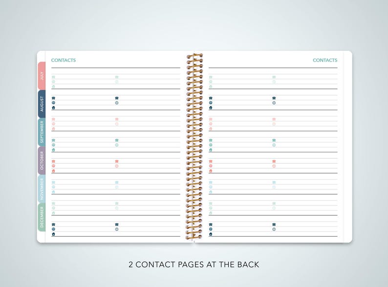 May include: A white planner with a gold spiral binding. The planner has a contact page for each month of the year, with colored tabs for each month. The planner also has two contact pages at the back.