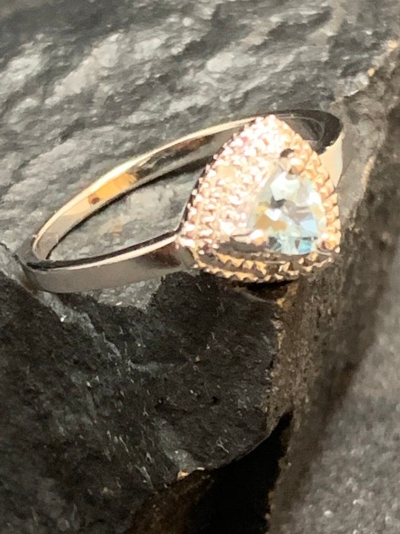 Sterling silver genuine blue topaz ring with diamo