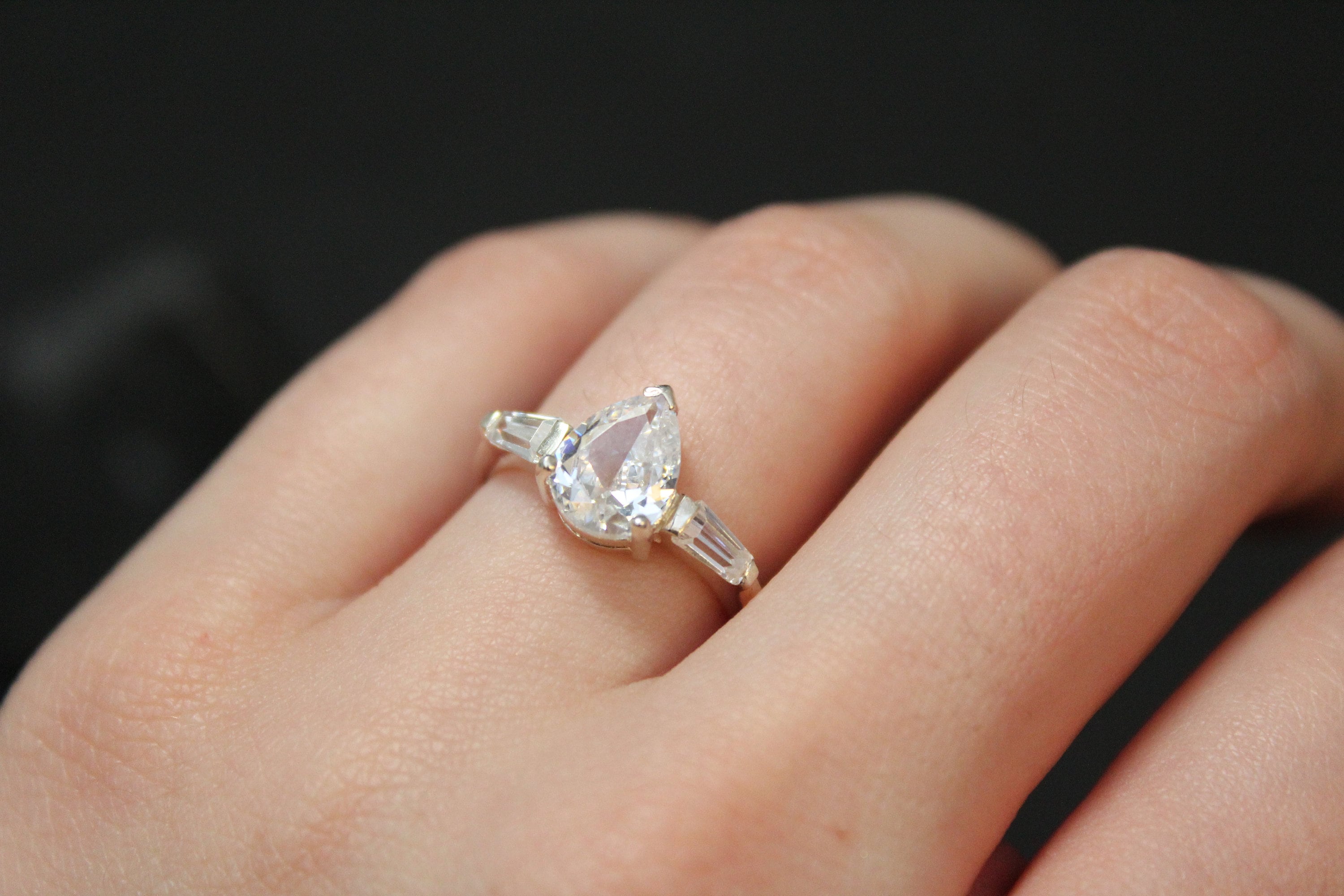 Sterling Silver Pear Shaped CZ Engagement Ring with Baguette Accents
