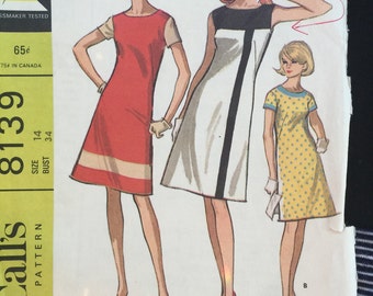 McCall's 8139; ©1965; Misses' and Junior Dress in Three Versions: Color Block Lightly fitted and flared dress,