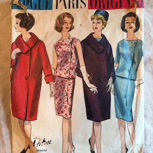 May include: Vintage Vogue Paris Original sewing pattern for a Patou printed pattern dress. The pattern number is 1067. The pattern shows four different styles of dresses, including a red coat, a floral print dress, a purple dress, and a blue dress.