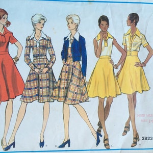 May include: A vintage sewing pattern featuring five different dress designs. The pattern is for Vogue's Basic Design and includes instructions for making a variety of styles.