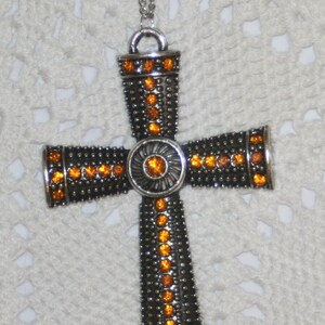 Handsome Mid-Size Silvertone Metal Beaded Pectoral Cross with Amber Rhinestones