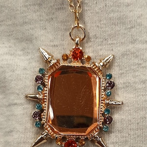 May include: A white ceramic mug with a black handle and the text "But First, Coffee" in a handwritten style. The mug is on a white surface. The mug is approximately 4 inches tall.