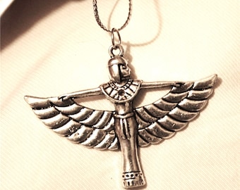 May include: Silver pendant necklace featuring a winged goddess with outstretched arms. The goddess is wearing a crown and a decorative collar.