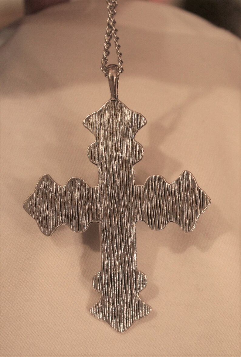 Handsome Festooned Flowers Shiny Finish Truncated Silvertone Cross