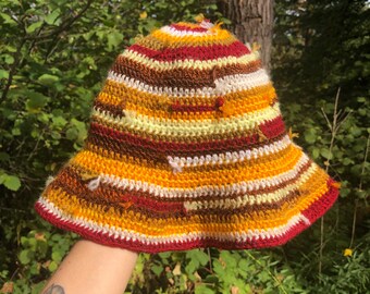 Distressed bucket hat, sun, floppy, visor, brim, yarn ends, patchwork, red, yellow, brown, lightweight, handmade, crochet, acrylic, summer
