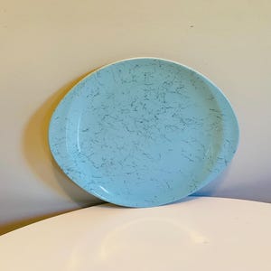 May include: A light blue oval serving platter with a marbled design.