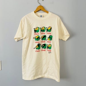 ヴィンテージ 1990 年代 ジョンソン シグネチャー クリック カートゥーン T シャツ、1991 年、L サイズ、米国製、シングルステッチ、ユーモラスなグラフィック プリント T シャツ