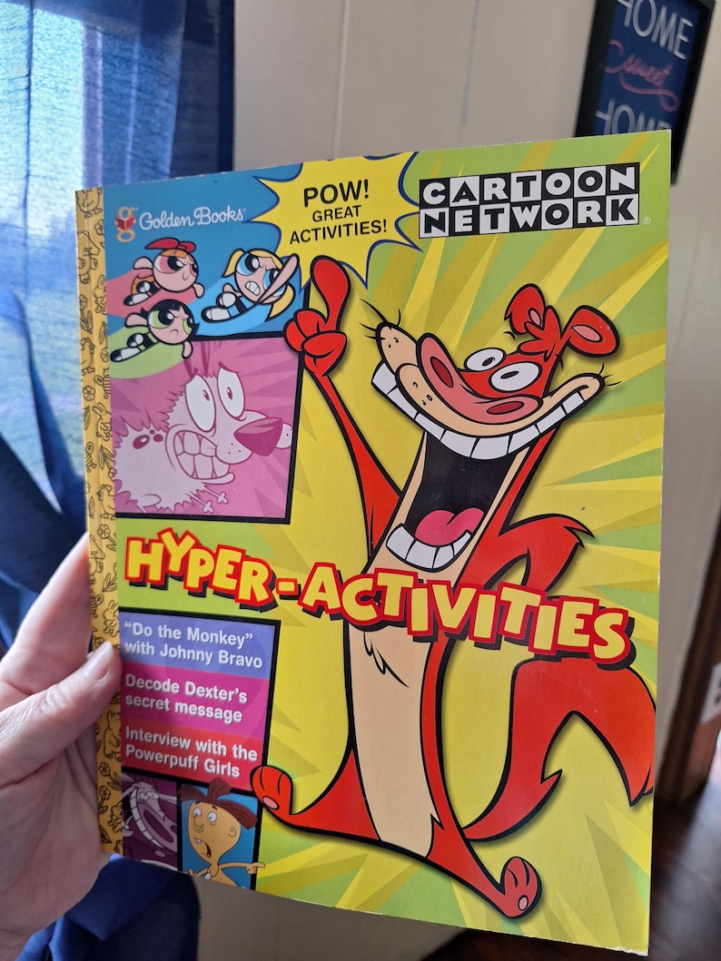 May include: A Golden Books "Hyper-Activities" book featuring Cartoon Network characters. The cover has a yellow background with the words "POW! GREAT ACTIVITIES!" and "CARTOON NETWORK". The book includes "Do the Monkey" with Johnny Bravo and more.