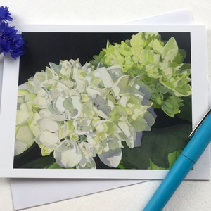 White Hydrangea Watercolor greeting card with two clusters of white and pale green hydrangea on a field of black.