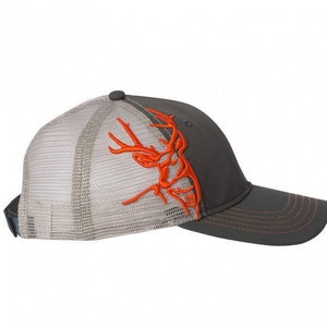 May include: A gray and white mesh baseball cap with an orange embroidered deer head design. The cap has a curved brim and a mesh back.