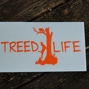 May include: Orange vinyl sticker with a tree silhouette and the text "TREEDLIFE".