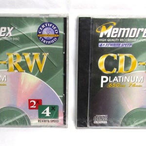 May include: A set of three ceramic mugs with a speckled, matte finish in cream, light grey, and dark grey. Each mug has a simple, minimalist design and a rounded handle.