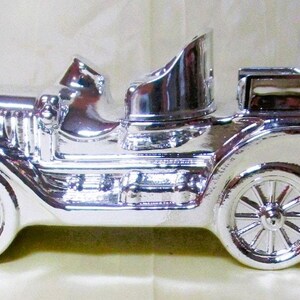 Avon After Shave Decanter Silver Stanley Steamer Tai Winds 5 Ounces 1978
