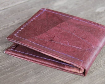 Wallet made of leaves in wine red and purple, folded once