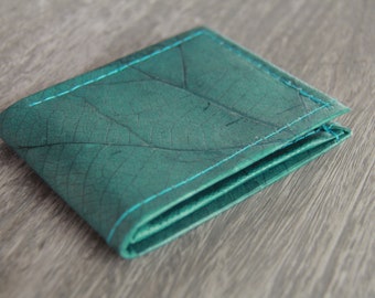 Wallet made of leaves in turquoise-purple, folded once