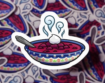 May include: A sticker featuring a cartoon illustration of a bowl of steaming red beet soup with a dollop of sour cream on top. The bowl is blue and white with a floral pattern.