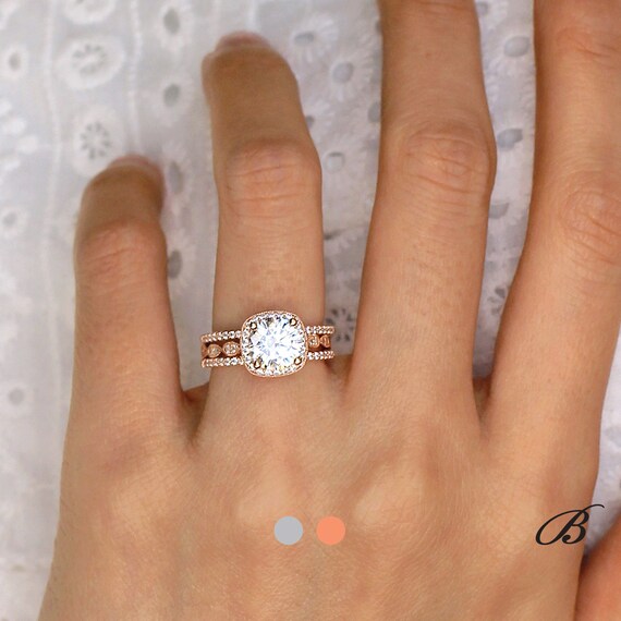 two wedding bands with engagement ring