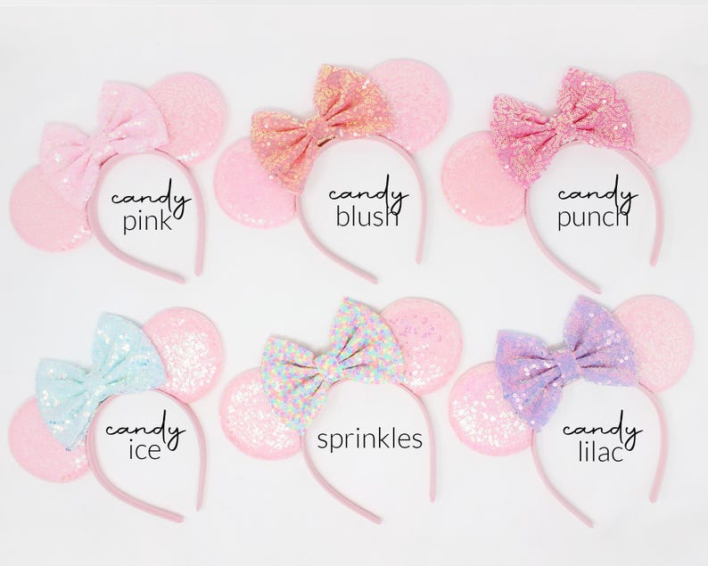 May include: Six headbands with round ears and bows, each featuring different sequin colors and textures. The text labels are candy pink, candy blush, candy punch, candy ice, sprinkles, and candy lilac, displayed next to each corresponding headband.