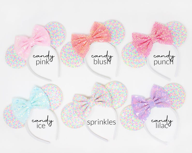 May include: Six headbands with round ears covered in multicolored confetti glitter and large sequined bows. The bows are labeled candy pink, candy blush, candy punch, candy ice, sprinkles, and candy lilac, each featuring a distinct pastel color.