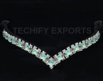 May include: A black horse browband with a V-shaped design. The browband is decorated with square, opalescent gemstones and clear crystals. The text "TECHIFY EXPORTS" is visible on the image.