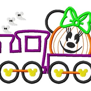 May include: A purple and white train with a pumpkin-shaped Mickey Mouse head. The pumpkin has a green bow and orange and white stripes. The train has three wheels with Mickey Mouse ears on each.