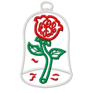 May include: Embroidered design of a red rose with a green stem and leaves, enclosed in a white bell jar shape. The rose has a monogram in the center. The design is on a white background.