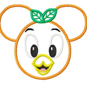 May include: A cartoon-style character face with a white oval shape, black eyes, and a yellow beak. The character has orange ears and a green leaf design on top. The design is likely for embroidery or a similar craft.