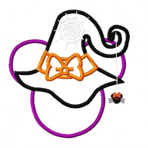 May include: A purple circle with a black witch hat with an orange bow and a white spider web on top. A black spider with a red bow is hanging from the hat.