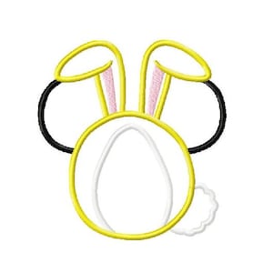 May include: A yellow bunny rabbit applique with black ears and a white fluffy tail.