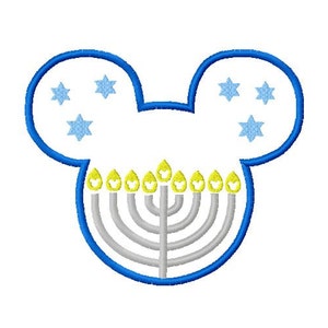 May include: Blue Mickey Mouse ears with a menorah in the center. The menorah has nine candles, with yellow flames and a silver base. There are five blue stars on each ear.
