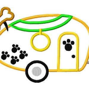 May include: A yellow and orange camper with a green awning, a black paw print design, and a bone on top. The camper has a yellow door with a black paw print and a yellow circle for a window.