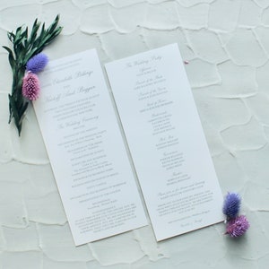 Pode incluir: Programa da cerim&ocirc;nia de casamento com os nomes de Elizabeth Billing e Natiff Amit Baggan. O programa lista a ordem dos eventos, incluindo a prociss&atilde;o, as leituras das Escrituras e a troca de votos. O programa tamb&eacute;m inclui os nomes dos membros da festa de casamento.
