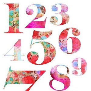 May include: A collection of numbers 0 through 9, each with a unique watercolor-style design. The numbers are in various sizes and shapes, with a mix of red, pink, blue, and yellow hues. The background is white.