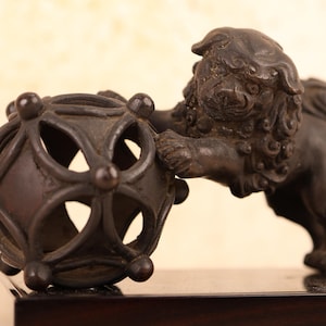 Antique Mini Bronze Japanese Shishi Leaning on Globe (24J-539)