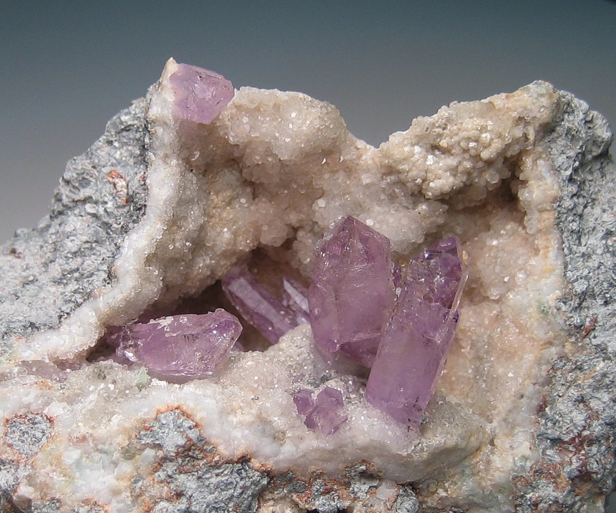 Amethyst Display Specimen from a Geode Side Almost Fluorescent 10673C Amethyst Display Specimen from a Geode Side Almost Fluorescent 10673C