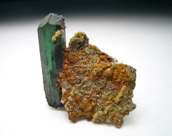Vivianite Specimen from Huanuni Mine, Bolivia, Double pointed crystals on siderite matrix w/ pyrites/calcites, Saturated green--hint of blue