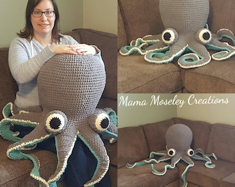 May include: A gray crocheted octopus with teal accents. The octopus is sitting on a brown couch. The octopus is large enough to be used as a pillow.