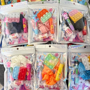 Bolsa de regalo para niñas, brillo labial, juguete antiestrés y papelería.