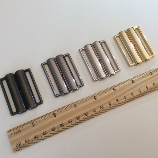 40-mm-Gürtelschnalle aus Metall. Verschluss in den Farben Silber, Gold, Rauch oder Bronze. Geschenk-Modeaccessoire für sie.