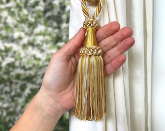 Classy tie back with tassel. Golden and ivory colored elegant decor for window curtain. Handmade italian tuscany drapery decor