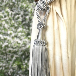 Classy tie back with tassel. Gray and white colored elegant decor for window curtain. Handmade italian tuscany drapery decor