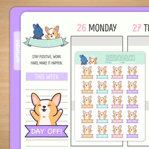 May include: A sheet of colorful stickers featuring a cartoon corgi dog with the text "Day Off!" on a banner. The stickers are designed for a planner or journal and feature a variety of pastel colors.