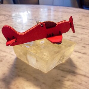 1 small hand-sewn airplane made of high-quality vegetable hand-dyed leather from Tuscany image 3