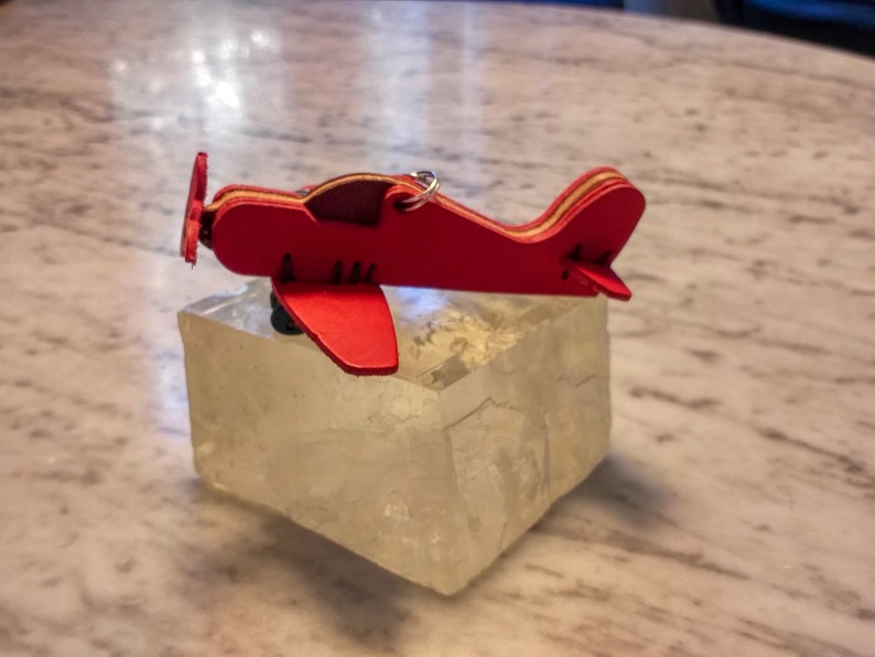 1 small hand-sewn airplane made of high-quality vegetable hand-dyed leather from Tuscany image 1